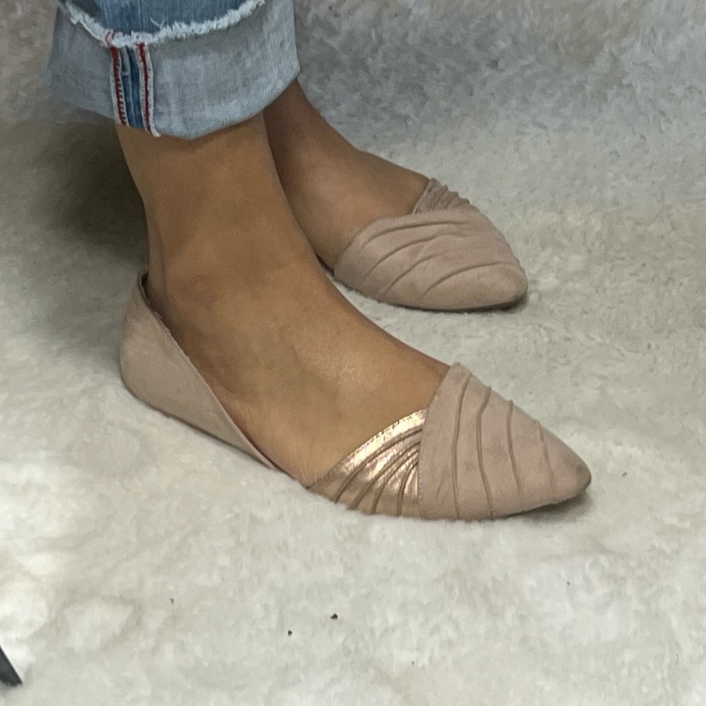 Well worn pink flats